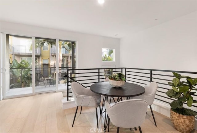 dining area featuring light wood finished floors