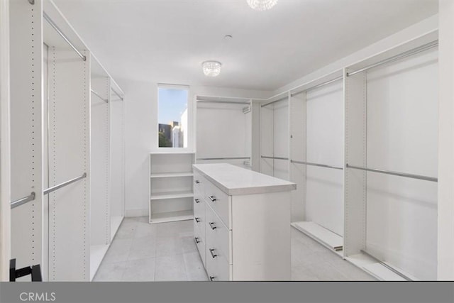 spacious closet featuring light tile patterned floors