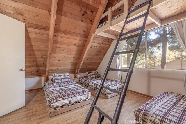 bedroom with wooden ceiling, light hardwood / wood-style flooring, and lofted ceiling with beams