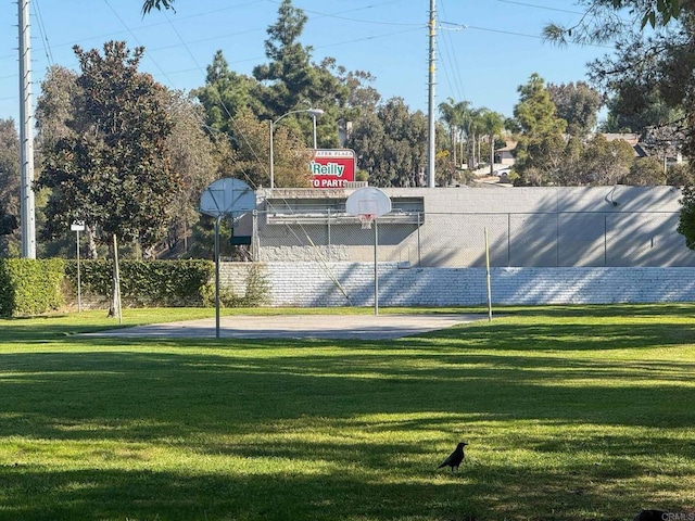 view of basketball court featuring a lawn