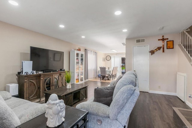 living room with dark hardwood / wood-style floors