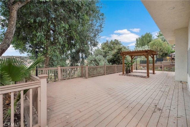 wooden deck featuring a pergola