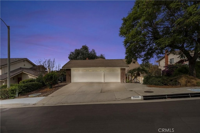 view of front of property with a garage