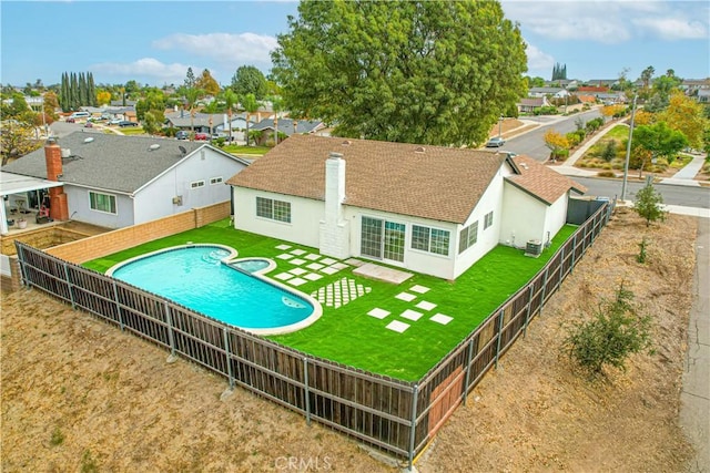 view of pool featuring central AC unit and a patio area