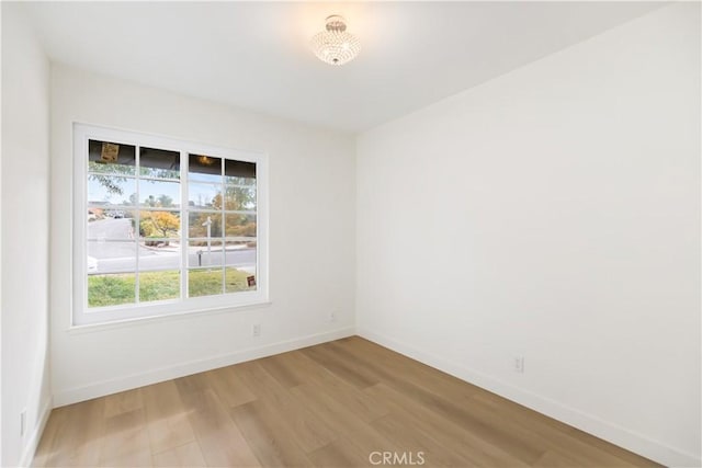 unfurnished room featuring hardwood / wood-style floors