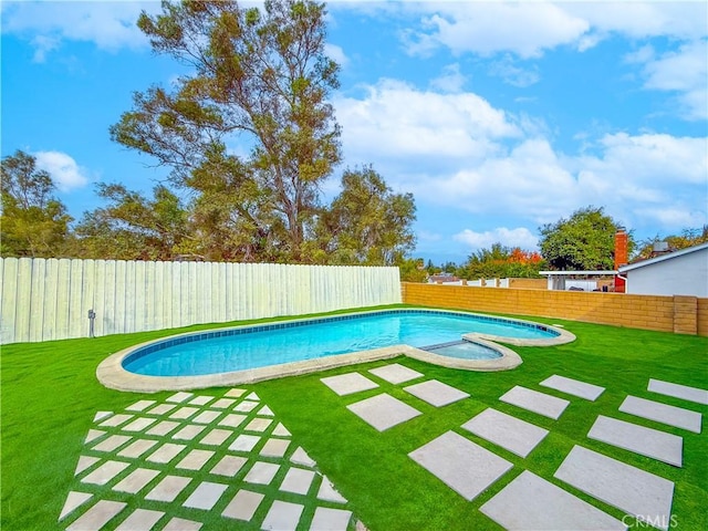 view of swimming pool with a lawn