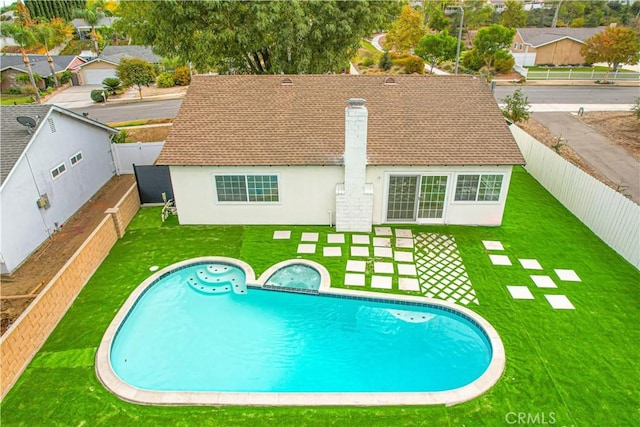 view of pool featuring a patio and a lawn