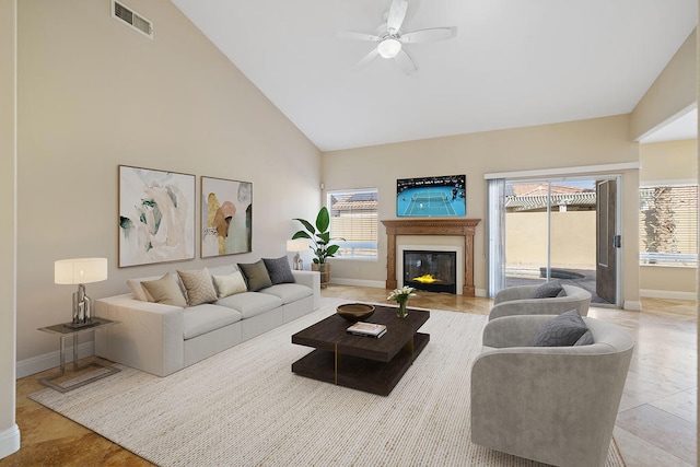 living room featuring high vaulted ceiling and ceiling fan