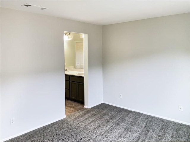 empty room featuring light carpet