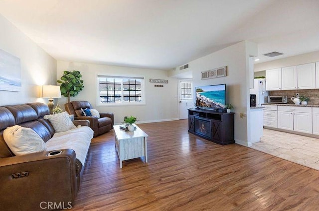 living room featuring dark hardwood / wood-style floors