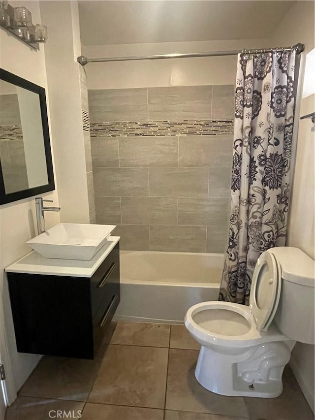 full bathroom featuring tile patterned floors, vanity, toilet, and shower / bathtub combination with curtain