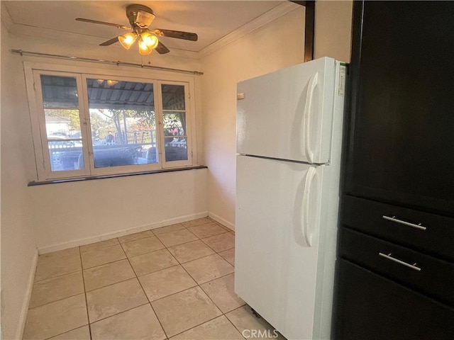 kitchen featuring ceiling fan, white refrigerator, light tile patterned floors, and crown molding