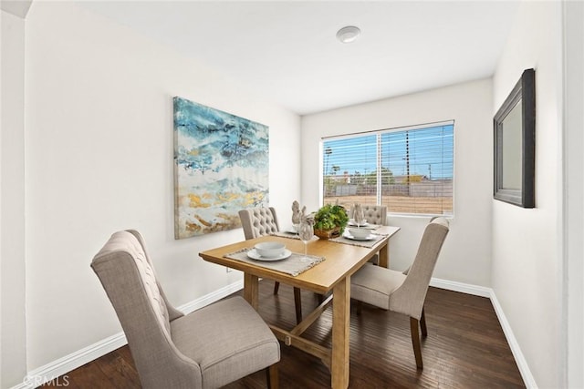 dining room with dark hardwood / wood-style flooring