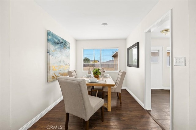 dining area featuring dark hardwood / wood-style floors