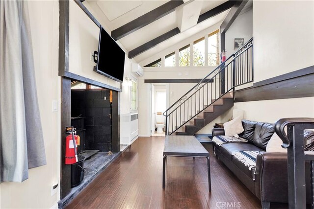 living room with beam ceiling, dark hardwood / wood-style flooring, high vaulted ceiling, and an AC wall unit