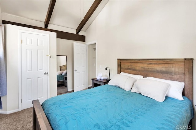 carpeted bedroom with beamed ceiling and high vaulted ceiling