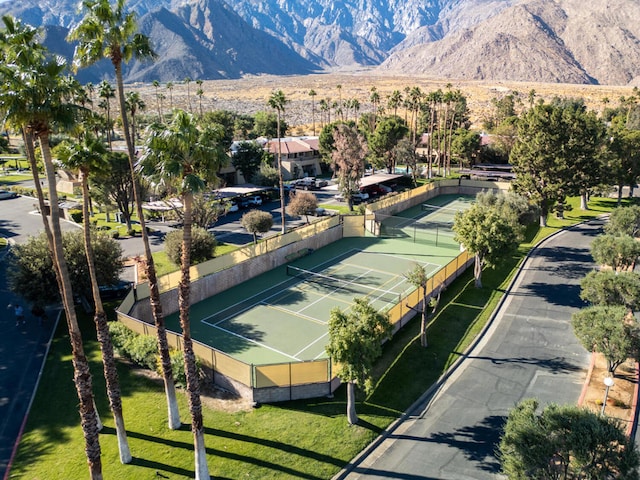 view of tennis court featuring a mountain view