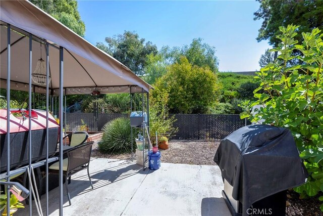 view of patio / terrace featuring a gazebo and area for grilling