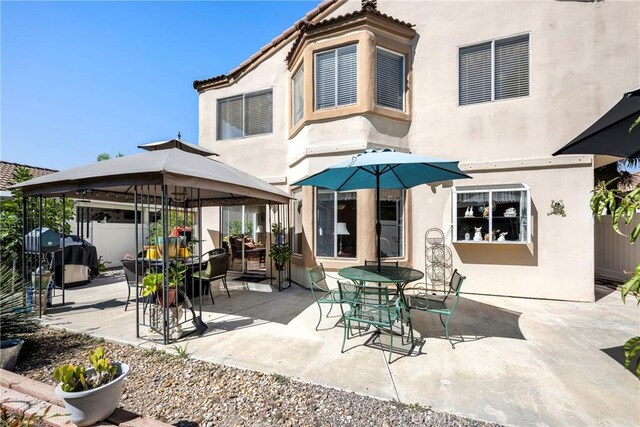 rear view of house featuring a patio area