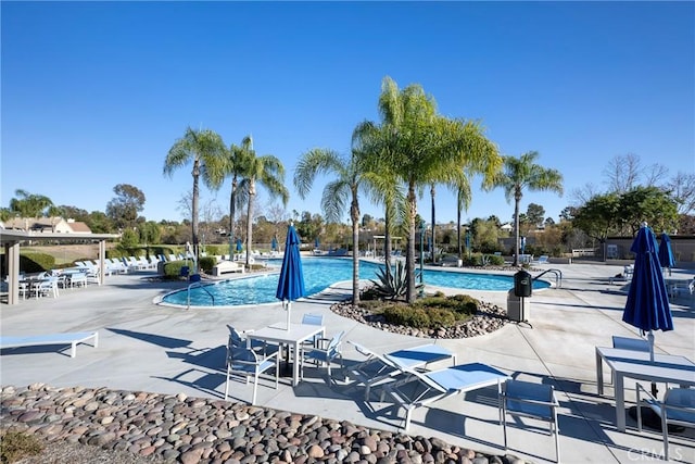 community pool with a patio