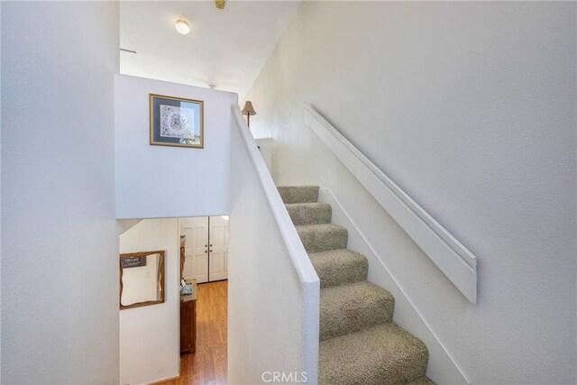 stairway featuring hardwood / wood-style flooring