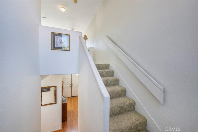 stairs with wood finished floors