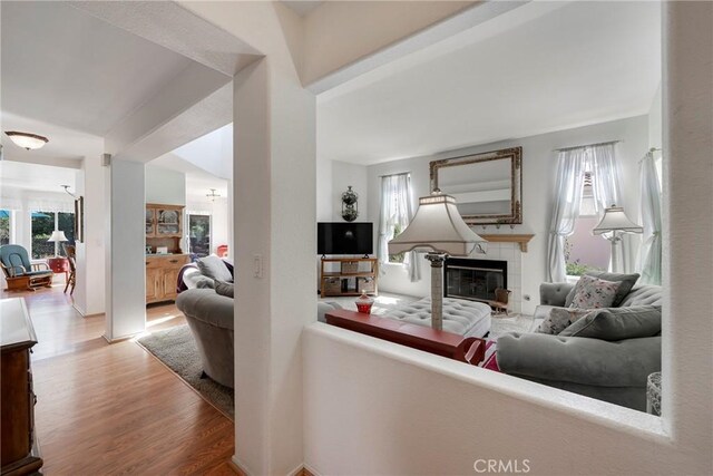 living room with a fireplace and light hardwood / wood-style floors