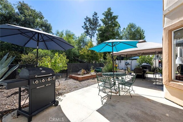 view of patio with a gazebo and a grill