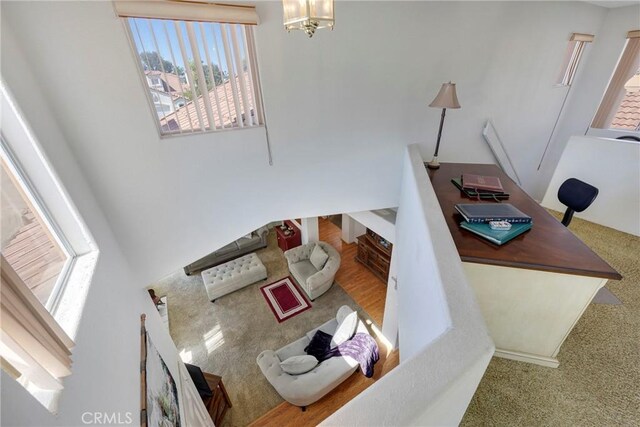 interior space featuring a healthy amount of sunlight and an inviting chandelier