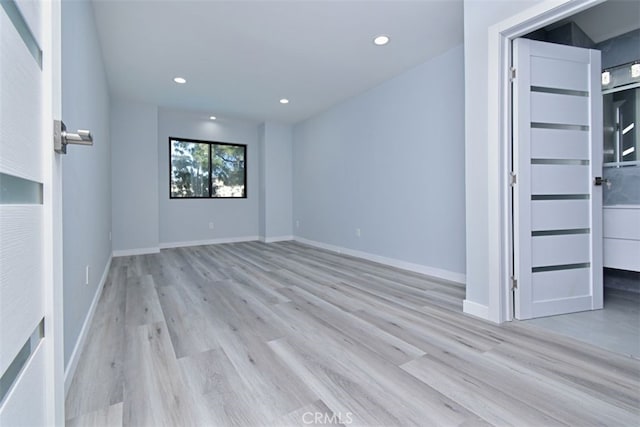 empty room with light wood-type flooring