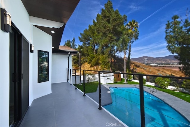 view of pool with a mountain view