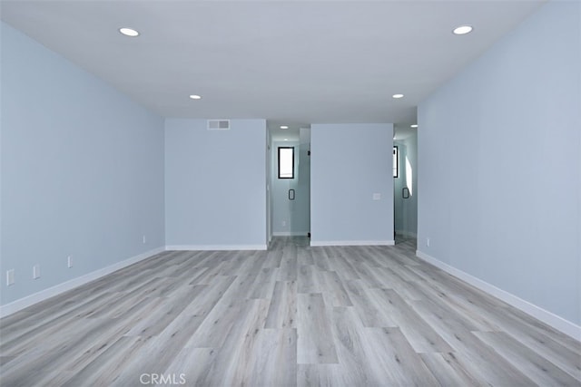 unfurnished room with light hardwood / wood-style flooring