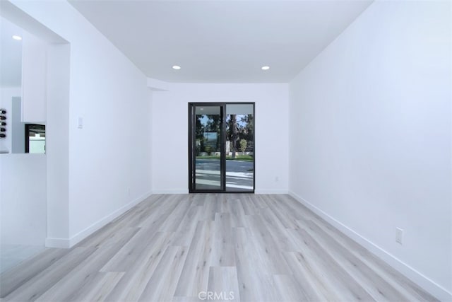 unfurnished room featuring light wood-type flooring