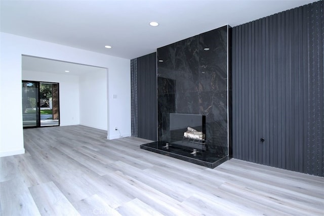 unfurnished living room featuring light wood-type flooring