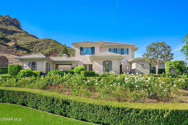 mediterranean / spanish-style home featuring a mountain view