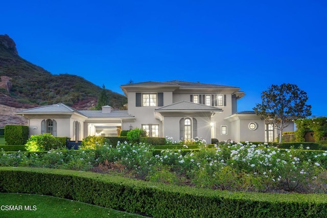 view of front of property with a mountain view