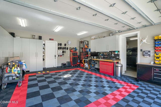 garage with a workshop area