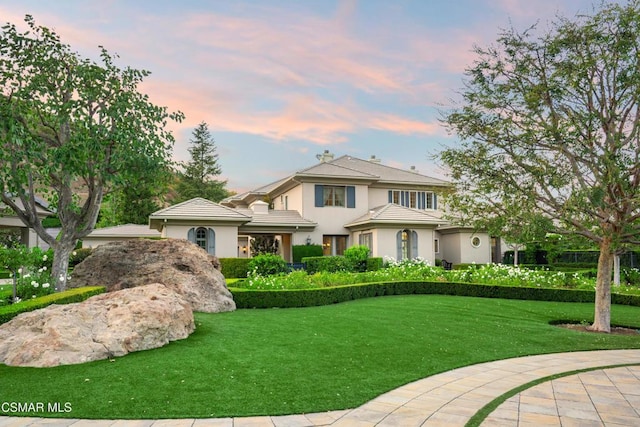 view of front of house with a lawn