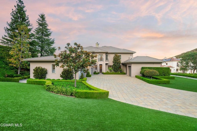 view of front of property with a yard