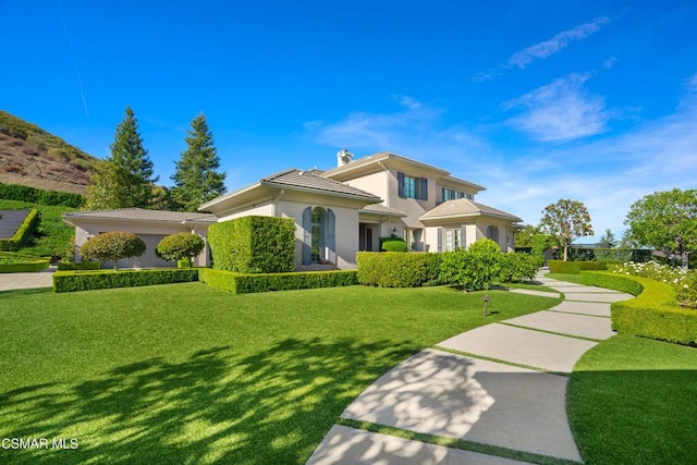 view of front facade with a front lawn