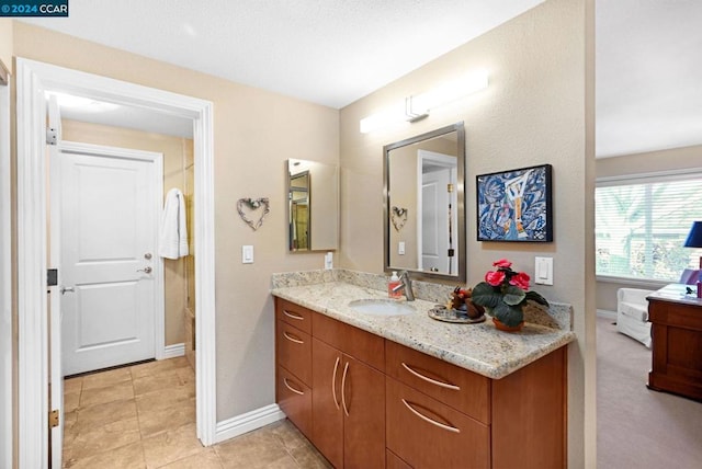 bathroom featuring tile patterned floors and vanity