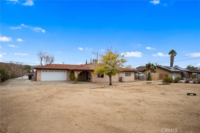 single story home with a garage