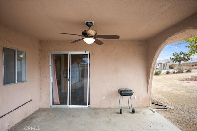 view of patio featuring ceiling fan