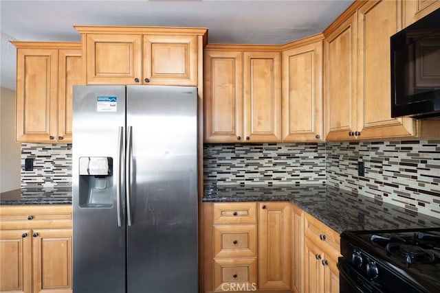 kitchen with dark stone counters, backsplash, and black appliances