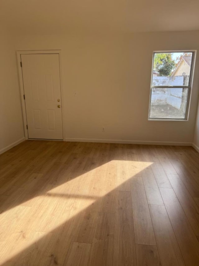 unfurnished room featuring light hardwood / wood-style flooring