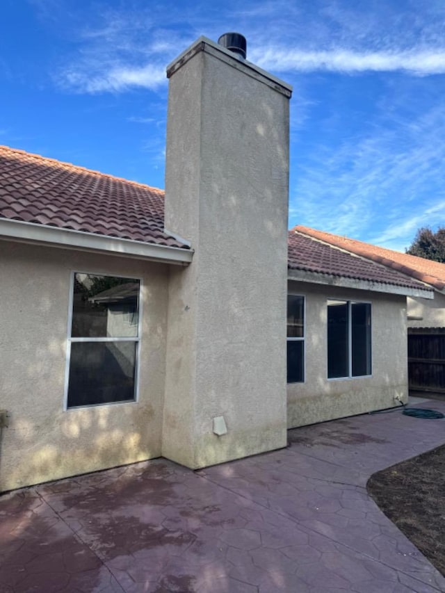 back of property featuring a patio area