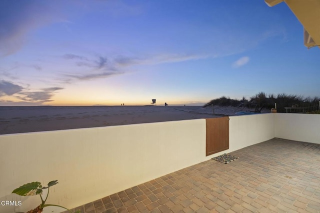 view of patio terrace at dusk