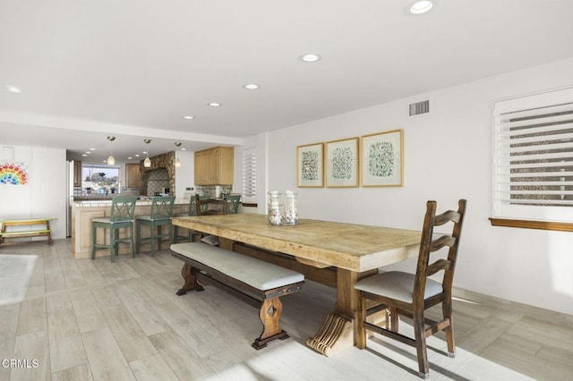 dining room with light hardwood / wood-style flooring