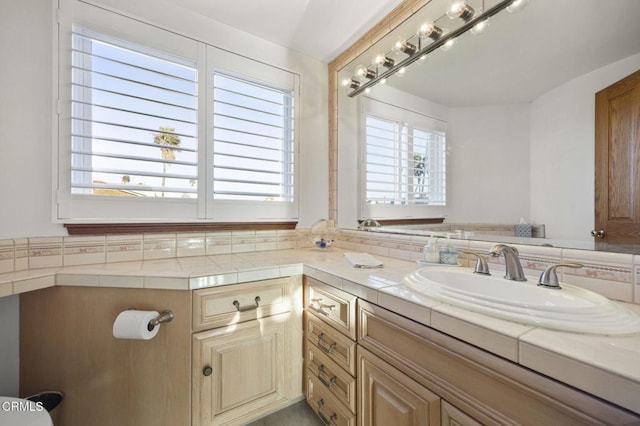 bathroom with vanity and a healthy amount of sunlight