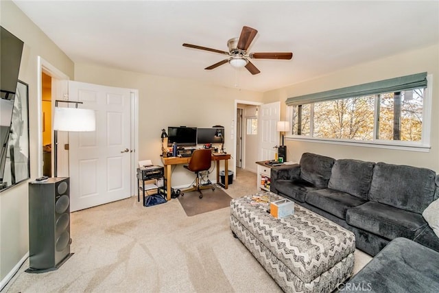 living room with ceiling fan and light colored carpet